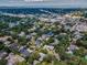 An aerial view displays diverse homes, lush greenery, and a desirable coastal community at 3416 W Morrison Ave, Tampa, FL 33629