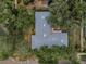 Aerial view of the roof, yard and mature trees at 3416 W Morrison Ave, Tampa, FL 33629