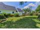 Green backyard with lush green lawn and fence in a well-maintained lawn at 3416 W Morrison Ave, Tampa, FL 33629