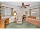 Bedroom featuring a ceiling fan, vintage furniture, and lots of natural light at 3416 W Morrison Ave, Tampa, FL 33629