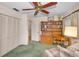 Bedroom with a ceiling fan, built in shelves, and an office area at 3416 W Morrison Ave, Tampa, FL 33629