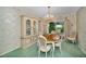 Elegant dining room with a chandelier, a china cabinet, and a sliding glass door to the outside at 3416 W Morrison Ave, Tampa, FL 33629