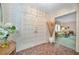 Inviting foyer with patterned tile flooring, a double door entry, and view into the adjacent living room at 3416 W Morrison Ave, Tampa, FL 33629