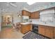 Charming kitchen with wood cabinets, tiled floors, and a breakfast nook with views to the dining room at 3416 W Morrison Ave, Tampa, FL 33629