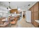 Bright kitchen with light wood cabinets, stainless appliances, and a cozy breakfast nook at 3416 W Morrison Ave, Tampa, FL 33629