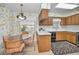 Kitchen nook area with wood cabinets, tiled floor, and a view of the yard from the window at 3416 W Morrison Ave, Tampa, FL 33629