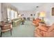 Large living room featuring comfortable seating, classic decor, and abundant natural light at 3416 W Morrison Ave, Tampa, FL 33629