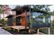 Contemporary home featuring wood and dark panel siding with an elevated deck at 344 Bay St, Palm Harbor, FL 34683