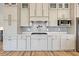 Well-appointed kitchen featuring custom cabinetry, a stylish backsplash, and modern appliances at 344 Bay St, Palm Harbor, FL 34683