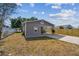 View of house with large concrete driveway and fenced-in backyard at 3535 16Th N St, St Petersburg, FL 33704