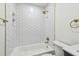Bathroom with a hexagon tile surround bathtub and brass hardware at 3535 16Th N St, St Petersburg, FL 33704