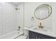 Modern bathroom with hexagon tile surround bathtub and brass hardware at 3535 16Th N St, St Petersburg, FL 33704