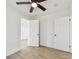 Bright, airy bedroom featuring wood-look flooring and a modern ceiling fan at 3535 16Th N St, St Petersburg, FL 33704