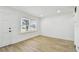 Bright bedroom with new flooring, a window, and fresh paint at 3535 16Th N St, St Petersburg, FL 33704