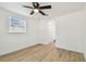 Bedroom featuring light wood flooring, neutral paint, and a ceiling fan with a light at 3535 16Th N St, St Petersburg, FL 33704