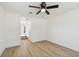 Bedroom featuring light wood flooring, neutral paint, and a ceiling fan with a light at 3535 16Th N St, St Petersburg, FL 33704