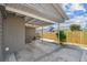 Carport featuring a concrete floor and a side entrance door at 3535 16Th N St, St Petersburg, FL 33704