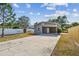 Long concrete driveway leading to the carport and fenced-in yard at 3535 16Th N St, St Petersburg, FL 33704