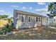 This delightful one-story home showcases a neat exterior, a welcoming porch, and tidy landscaping at 3535 16Th N St, St Petersburg, FL 33704