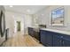 Bright kitchen features new appliances, a subway tile backsplash, white countertops, and dark blue cabinets at 3535 16Th N St, St Petersburg, FL 33704