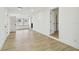 Open floor plan features light wood flooring, neutral paint, and recessed lighting at 3535 16Th N St, St Petersburg, FL 33704