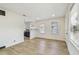 Spacious living area with new flooring, recessed lighting, and views of the modern kitchen at 3535 16Th N St, St Petersburg, FL 33704