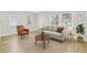 Bright living room featuring a cozy sitting area, modern decor, and natural light from two windows at 3535 16Th N St, St Petersburg, FL 33704