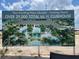 Sign displays new clubhouse with resort-style pool, offering a luxurious lifestyle at 3546 Malta Ave, Wesley Chapel, FL 33543