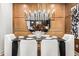 Contemporary dining room with stylish mirror and seating for six at 3546 Malta Ave, Wesley Chapel, FL 33543
