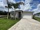 Charming single-story home with a two-car garage and well-manicured lawn at 3546 Malta Ave, Wesley Chapel, FL 33543