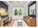 Stylish home office with a comfortable seating area and bright natural light at 3546 Malta Ave, Wesley Chapel, FL 33543