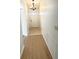 Hallway features a chandelier and tile and hardwood flooring at 3621 102Nd N Pl, Clearwater, FL 33762
