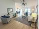 Bright and airy living room with stylish decor, light wood floors, and ample natural light at 3621 102Nd N Pl, Clearwater, FL 33762