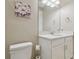 Bathroom featuring quartz counters and white cabinets at 4165 San Severo Rd, Wesley Chapel, FL 33543