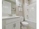 Fresh bathroom with white tiling, a clean vanity, and a shower-tub combination at 4165 San Severo Rd, Wesley Chapel, FL 33543