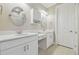 Elegant bathroom with double vanity, ample cabinet space, and modern fixtures at 4165 San Severo Rd, Wesley Chapel, FL 33543