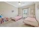 Cozy bedroom with twin beds, a ceiling fan, and a charming setup perfect for  at 4165 San Severo Rd, Wesley Chapel, FL 33543