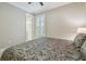 Neutral bedroom with carpet, window with shutters and queen-sized bed at 4165 San Severo Rd, Wesley Chapel, FL 33543