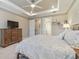 Relaxing bedroom with neutral tones, tray ceiling, and natural light at 4165 San Severo Rd, Wesley Chapel, FL 33543