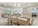 Open-concept dining area with views into living room and kitchen beyond at 4165 San Severo Rd, Wesley Chapel, FL 33543