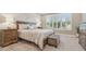 Comfortable bedroom with neutral tones, plantation shutters, and a plush king-size bed at 4165 San Severo Rd, Wesley Chapel, FL 33543