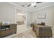 Home office with built-in desk, views of dining area, and light wood floors at 4165 San Severo Rd, Wesley Chapel, FL 33543