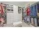 Spacious walk-in closet with custom shelving and ample storage space for clothing and accessories at 4165 San Severo Rd, Wesley Chapel, FL 33543