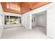 Sun-filled bonus room with beautiful wood ceiling, large windows, and access to the living room at 417 Broadway, Dunedin, FL 34698