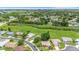 Wide aerial shot featuring the surrounding neighborhood with green spaces and waterways nearby at 4500 Great Lake S Dr, Clearwater, FL 33762
