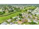 Aerial perspective showcases the neighborhood's layout and proximity to green spaces and waterways at 4500 Great Lake S Dr, Clearwater, FL 33762
