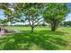 Expansive backyard featuring a patio and shade trees at 4500 Great Lake S Dr, Clearwater, FL 33762