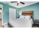 Comfortable bedroom featuring a wood-accented headboard, neutral decor, and closet for storage at 4500 Great Lake S Dr, Clearwater, FL 33762