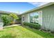 Well-kept front yard with lush landscaping and trimmed hedges at 4500 Great Lake S Dr, Clearwater, FL 33762
