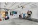 Spacious two-car garage with an automatic door opener, white walls and concrete floor at 4500 Great Lake S Dr, Clearwater, FL 33762
